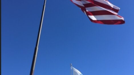 Flags outside of Storage of America on Range Road.