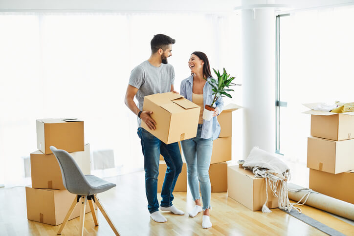 Young couple moving into a new home