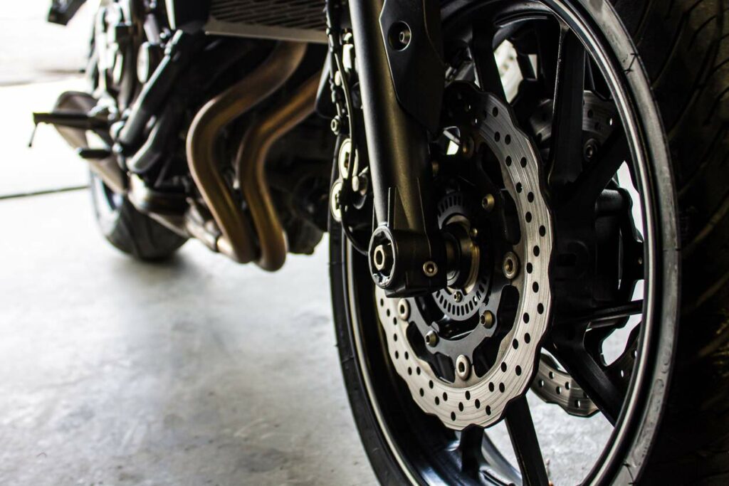 A close-up view of the front wheel of a motorcycle