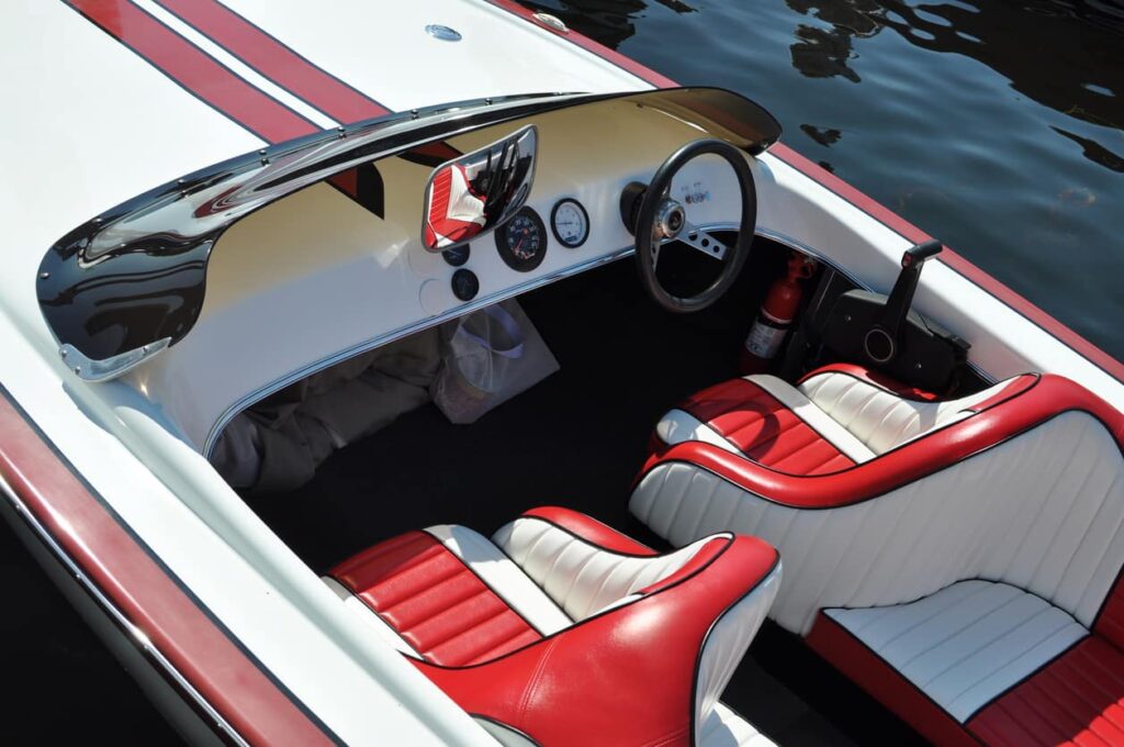 Red and white front seats of a boat.