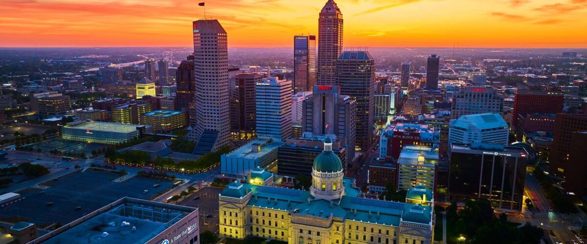 Breathtaking Drone Shot of Downtown Indianapolis at Golden Hour, Showcasing the Historic Courthouse Amid Bustling Cityscape, 2023