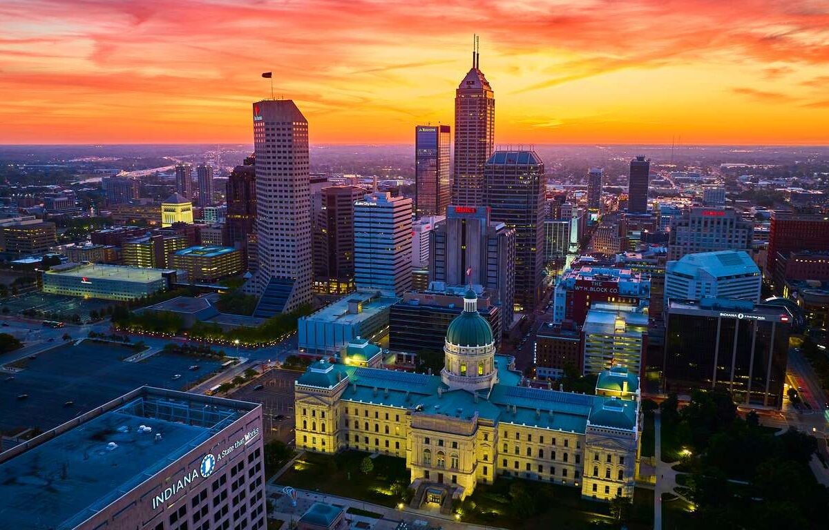 Breathtaking Drone Shot of Downtown Indianapolis at Golden Hour, Showcasing the Historic Courthouse Amid Bustling Cityscape, 2023